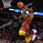 
              Iowa State guard Izaiah Brockington (1) goes up for a shot as he is fouled by Chicago State forward Teddy Bayi Ba Mandeng (22) during the first half of an NCAA college basketball game Tuesday, Dec. 21, 2021, in Ames, Iowa. (AP Photo/Matthew Putney)
            