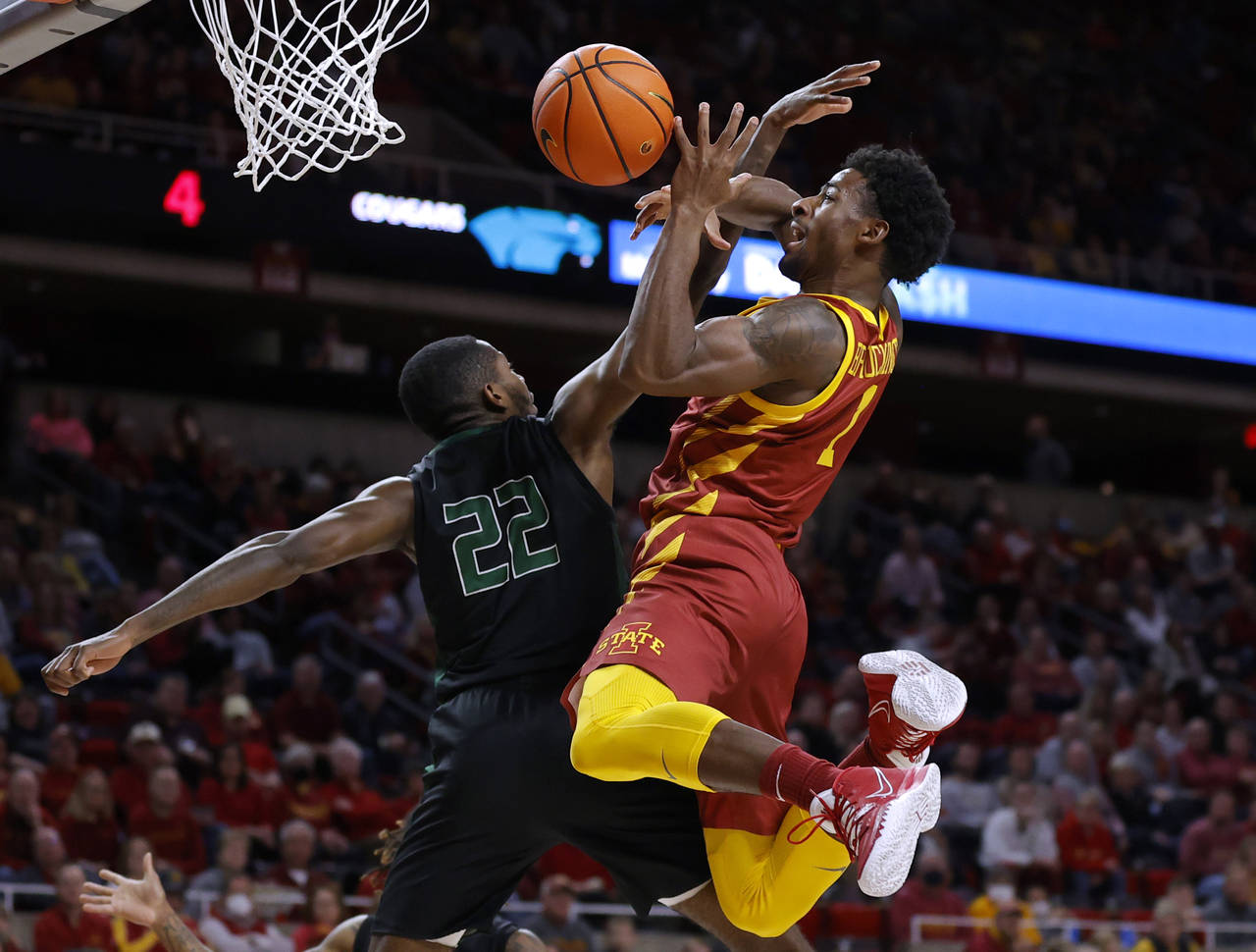 Iowa State guard Izaiah Brockington (1) goes up for a shot as he is fouled by Chicago State forward...