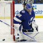
              Tampa Bay Lightning goaltender Andrei Vasilevskiy (88) makes a save on a shot by the Los Angeles Kings during the third period of an NHL hockey game Tuesday, Dec. 14, 2021, in Tampa, Fla. (AP Photo/Chris O'Meara)
            