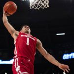 
              Wisconsin guard Johnny Davis (1) scores during the first half of an NCAA college basketball game against the Georgia Tech  Wednesday, Dec. 1, 2021, in Atlanta. (AP Photo/Hakim Wright Sr.)
            
