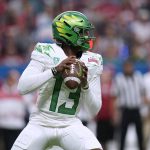 
              Oregon quarterback Anthony Brown (13) looks to throw a pass against Oklahoma during the first half of the Alamo Bowl NCAA college football game Wednesday, Dec. 29, 2021, in San Antonio. (AP Photo/Eric Gay)
            