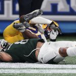 
              Pittsburgh defensive back Damarri Mathis (21) hits the turf after breaking up a pass intended for Michigan State wide receiver Jalen Nailor (8) during the second half of the Peach Bowl NCAA college football game, Thursday, Dec. 30, 2021, in Atlanta. (AP Photo/John Bazemore)
            