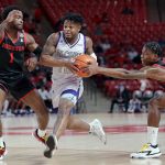 
              Alcorn State guard Paul King, middle, has the ball stripped away by Houston guard Marcus Sasser (0) as Jamal Shead (1) follows during the first half of an NCAA college basketball game, Monday, Dec. 6, 2021, in Houston. (AP Photo/Michael Wyke)
            