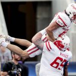 
              Houston wide receiver Jake Herslow (87) celebrates with offensive lineman Kody Russey (65) after scoring the go ahead touchdown against Auburn during the second half of the Birmingham Bowl NCAA college football game Tuesday, Dec. 28, 2021, in Birmingham, Ala. (AP Photo/Butch Dill)
            