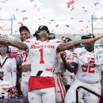 
              Houston wide receiver Nathaniel Dell (1) celebrates with teammates after the defeated Auburn in the Birmingham Bowl NCAA college football game Tuesday, Dec. 28, 2021, in Birmingham, Ala. (AP Photo/Butch Dill)
            