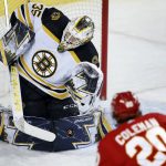 
              Boston Bruins goalie Linus Ullmark makes a save against Calgary Flames' Blake Coleman during the first period of an NHL hockey game Saturday, Dec. 11, 2021, in Calgary, Alberta. (Larry MacDougal/The Canadian Press via AP)
            