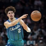 
              Charlotte Hornets guard LaMelo Ball (2) passes the ball during the first half of the team's NBA basketball game against the Houston Rockets, Monday, Dec. 27, 2021, in Charlotte, N.C. (AP Photo/Matt Kelley)
            