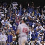 
              FILE - Los Angeles Dodgers fans cheer after Atlanta Braves' Joc Pederson (22) struck out during the night inning against the Los Angeles Dodgers in Game 3 of baseball's National League Championship Series Tuesday, Oct. 19, 2021, in Los Angeles. (AP Photo/Jae C. Hong, File)
            