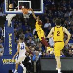 
              Iowa State's Tyrese Hunter (11), second left, dunks over Creighton's Ryan Hawkins (44) and Alex O'Connell (5) during the first half of an NCAA college basketball game Saturday, Dec. 4, 2021, at CHI Health Center in Omaha, Neb. (AP Photo/Rebecca S. Gratz)
            