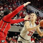 
              North Carolina State's Elissa Cunane (33) tries to shoot as Georgia's Jenna Staiti (14) defends during the second half of an NCAA college basketball game, Thursday, Dec. 16, 2021, in Raleigh, N.C. (AP Photo/Karl B. DeBlaker)
            