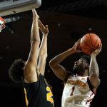
              Iowa State guard Izaiah Brockington (1) drives to the basket over Arkansas-Pine Bluff forward Trey Sampson, left, during the first half of an NCAA college basketball game, Wednesday, Dec. 1, 2021, in Ames, Iowa. (AP Photo/Charlie Neibergall)
            