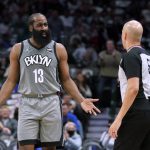 
              Brooklyn Nets guard James Harden talks to referee Aaron Smith during the first half of the team's NBA basketball game against the Dallas Mavericks in Dallas, Tuesday, Dec. 7, 2021. (AP Photo/Tony Gutierrez)
            