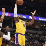 
              Los Angeles Lakers forward LeBron James (6) grabs a rebound from Memphis Grizzlies forward Kyle Anderson, left, Lakers forward Carmelo Anthony (7) and Grizzlies guard John Konchar (46) during the first half of an NBA basketball game Thursday, Dec. 9, 2021, in Memphis, Tenn. (AP Photo/Nikki Boertman)
            