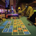 
              A dealer conducts a game of roulette in Bally's casino in Atlantic City, N.J. on June 23, 2021. On Thursday, Dec. 9, 2021, the American Gaming Association released statistics showing America's casinos have won more this year than ever before at $44.15 billion, and with more than a month still remaining in the year. (AP Photo/Wayne Parry)
            