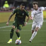 
              Portland Timbers midfielder Marvin Loria (44) and Real Salt Lake midfielder Albert Rusnák (11) vie for the ball during the first half of the MLS soccer Western Conference final Saturday, Dec. 4, 2021, in Portland, Ore. (AP Photo/Amanda Loman)
            