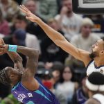 
              Utah Jazz center Rudy Gobert, right, defends against Charlotte Hornets guard Terry Rozier in the second half during an NBA basketball game Monday, Dec. 20, 2021, in Salt Lake City. (AP Photo/Rick Bowmer)
            