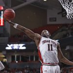 
              Texas Tech's Bryson Williams (11) rebounds the ball during the first half of an NCAA college basketball game against Arkansas State, Tuesday, Dec. 14, 2021, in Lubbock, Texas. (AP Photo/Brad Tollefson)
            