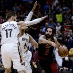 
              Cleveland Cavaliers guard Ricky Rubio (3) drives past New Orleans Pelicans forward Garrett Temple (41) and center Jonas Valanciunas (17) during the first quarter of an NBA basketball game in New Orleans, Tuesday, Dec. 28, 2021. (AP Photo/Derick Hingle)
            