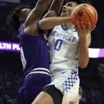 
              Kentucky's Jacob Toppin (0) shoots while defended by High Point's Emmanuel Izunabor, left, during the first half of an NCAA college basketball game in Lexington, Ky., Friday, Dec. 31, 2021. (AP Photo/James Crisp)
            