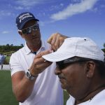 
              Henrik Stenson, of Sweden, signs autographs for fans before the first round of the Hero World Challenge PGA Tour at the Albany Golf Club, in New Providence, Bahamas, Thursday, Dec. 2, 2021.(AP Photo/Fernando Llano)
            