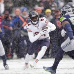 
              Chicago Bears wide receiver Marquise Goodwin (84) runs with the ball against the Seattle Seahawks during the first half of an NFL football game, Sunday, Dec. 26, 2021, in Seattle. (AP Photo/Stephen Brashear)
            