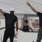 
              Brooks Koepka, of the United States, left, and Justin Thomas, of the United States, signal the direction of the ball after the Thomas' tee off during the second round of the Hero World Challenge PGA Tour at the Albany Golf Club, in New Providence, Bahamas, Friday, Dec. 3, 2021.(AP Photo/Fernando Llano)
            