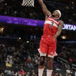 
              Washington Wizards' Bradley Beal makes a basket during the first half of an NBA basketball game against the Cleveland Cavaliers, Friday, Dec. 3, 2021, in Washington. (AP Photo/Luis M. Alvarez)
            