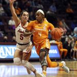 
              Jordan Walker (4) of Tennessee drives while defended by Virginia Tech's Georgia Amoore (5) in the first half of an NCAA college women's basketball game in Blacksburg Va., Sunday, Dec. 5, 2021. (Matt Gentry/The Roanoke Times via AP)
            