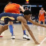 
              New Orleans Pelicans forward Herbert Jones, front, fights for the ball with Oklahoma City Thunder forward Aleksej Pokusevski during the first half of an NBA basketball game, Sunday, Dec. 26, 2021, in Oklahoma City. (AP Photo/Garett Fisbeck)
            