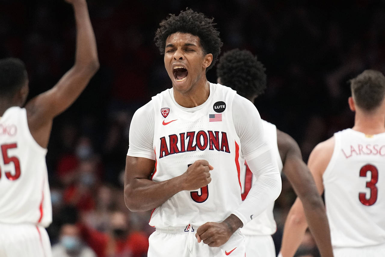 Arizona guard Justin Kier (5) reacts after scoring against California Baptist during the first half...
