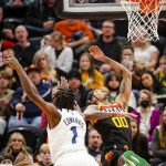 
              Utah Jazz guard Jordan Clarkson (00) loses the ball due to Minnesota Timberwolves forward Anthony Edwards' (1) hand during the first half of an NBA basketball game Friday, Dec. 31, 2021, in Salt Lake City. (AP Photo/Adam Fondren)
            
