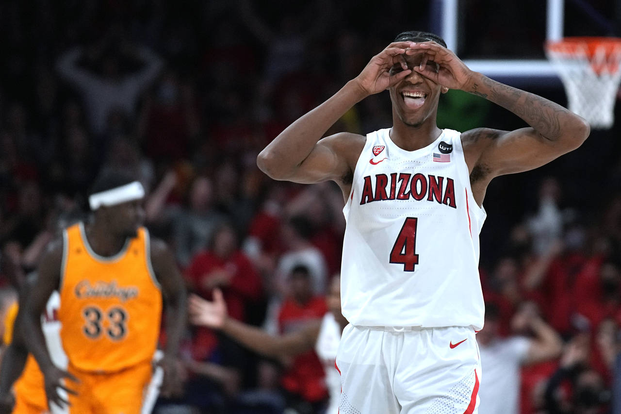Arizona guard Dalen Terry (4) reacts after scoring against Wyoming during the first half of an NCAA...