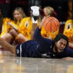 
              Jackson State forward Terence Lewis II dives for a loose ball during the second half of an NCAA college basketball game against Iowa State, Sunday, Dec. 12, 2021, in Ames, Iowa. Iowa State won 47-37. (AP Photo/Charlie Neibergall)
            