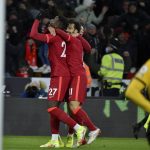 
              Liverpool's Divock Origi, left, celebrates after scoring the opening goal during the English Premier League soccer match between Wolverhampton Wanderers and Liverpool at the Molineux Stadium in Wolverhampton, England, Saturday, Dec. 4, 2021. (AP Photo/Rui Vieira)
            