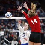 
              Pittsburgh's Kayla Lund, left, spikes the ball in front of Nebraska Ally Batenhorst during a semifinal of the NCAA women's college volleyball tournament Friday, Dec. 17, 2021, in Columbus, Ohio. (AP Photo/Paul Vernon)
            