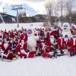 
              Skiers and snowboarders hit the slopes Sunday, Dec. 5, 2021 at Sunday River Ski Resort in Newry, Maine. The Santas gathered for the 21st annual Santa Sunday which raised over $4600 for the River Fund. (Andree Kehn/Sun Journal via AP)
            