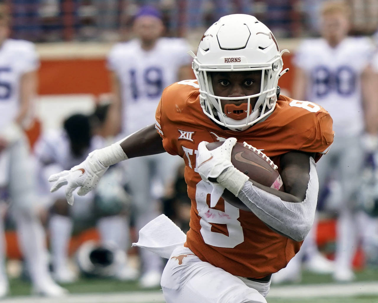 FILE - Texas' Xavier Worthy (8) runs with ball against Kansas State during the first half of an NCA...