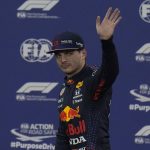 
              Red Bull driver Max Verstappen of the Netherlands waves after winning the pole position for the Formula One Abu Dhabi Grand Prix in Abu Dhabi, United Arab Emirates, Saturday Dec 11, 2021. (AP Photo/Hassan Ammar)
            