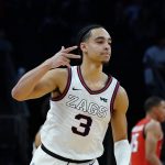 
              Gonzaga guard Andrew Nembhard celebrates his 3-pointer against Texas Tech during the second half of an NCAA college basketball game at the Jerry Colangelo Classic Saturday, Dec. 18, 2021, in Phoenix. Gonzaga won 69-55. (AP Photo/Ross D. Franklin)
            