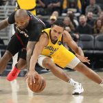 
              Miami Heat forward P.J. Tucker, left, and Indiana Pacers guard Malcolm Brogdon reach for the ball during the first half of an NBA basketball game in Indianapolis, Friday, Dec. 3, 2021. (AP Photo/AJ Mast)
            