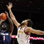 
              Jackson State forward Darius Hicks (1) shoots over Iowa State forward George Conditt IV (4) during the second half of an NCAA college basketball game, Sunday, Dec. 12, 2021, in Ames, Iowa. (AP Photo/Charlie Neibergall)
            