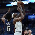 
              Denver Nuggets forward Will Barton goes to the basket against New Orleans Pelicans forward Herbert Jones (5) in the first half of an NBA basketball game in New Orleans, Wednesday, Dec. 8, 2021. (AP Photo/Gerald Herbert)
            