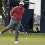 
              FILE - Jon Rahm, of Spain, reacts to his putt on the 17th green during the final round of the U.S. Open Golf Championship, June 20, 2021, at Torrey Pines Golf Course in San Diego. Rahm's birdie putts on the last two holes were the signature shots of his first major title. (AP Photo/Marcio Jose Sanchez, File)
            