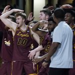 
              Loyola players watch during the final minutes of their win over Vanderbilt in an NCAA college basketball game Friday, Dec. 10, 2021, in Nashville, Tenn. (AP Photo/Mark Humphrey)
            