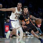 
              Orlando Magic guard Cole Anthony (50) drives past Los Angeles Lakers guard Avery Bradley (20) during the first half of an NBA basketball game in Los Angeles, Sunday, Dec. 12, 2021. (AP Photo/Ringo H.W. Chiu)
            