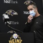 
              Baltimore Ravens head coach John Harbaugh arrives to take questions during a new conference after an NFL football game against the Pittsburgh Steelers, Sunday, Dec. 5, 2021, in Pittsburgh.  (AP Photo/Don Wright)
            
