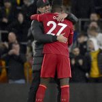 
              Liverpool's manager Jurgen Klopp hugs Liverpool's Divock Origi at the end of the English Premier League soccer match between Wolverhampton Wanderers and Liverpool at the Molineux Stadium in Wolverhampton, England, Saturday, Dec. 4, 2021. Origi scored the only goal of the match. (AP Photo/Rui Vieira)
            
