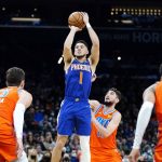 
              Phoenix Suns guard Devin Booker (1) shoots a 3-pointer over Oklahoma City Thunder guard Ty Jerome, middle, center Mike Muscala (33) and guard Aaron Wiggins (21) during the second half of an NBA basketball game Wednesday, Dec. 29, 2021, in Phoenix. The Suns won 115-97. (AP Photo/Ross D. Franklin)
            