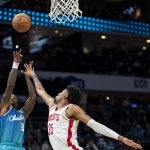 
              Houston Rockets center Christian Wood (35) attempts to block a shot from Charlotte Hornets guard Terry Rozier (3) during the first half of an NBA basketball game Monday, Dec. 27, 2021, in Charlotte, N.C. (AP Photo/Matt Kelley)
            