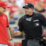 
              FILE - Cincinnati Reds' David Bell, left, talks with umpire Tripp Gibson, right, between batters during the first inning of a baseball game against the San Diego Padres in Cincinnati, July 1, 2021. Major League Baseball umpire Gibson grew up in Mayfield, Ky., and is back home this week after the town was devastated by a tornado last week. (AP Photo/Aaron Doster, File)
            